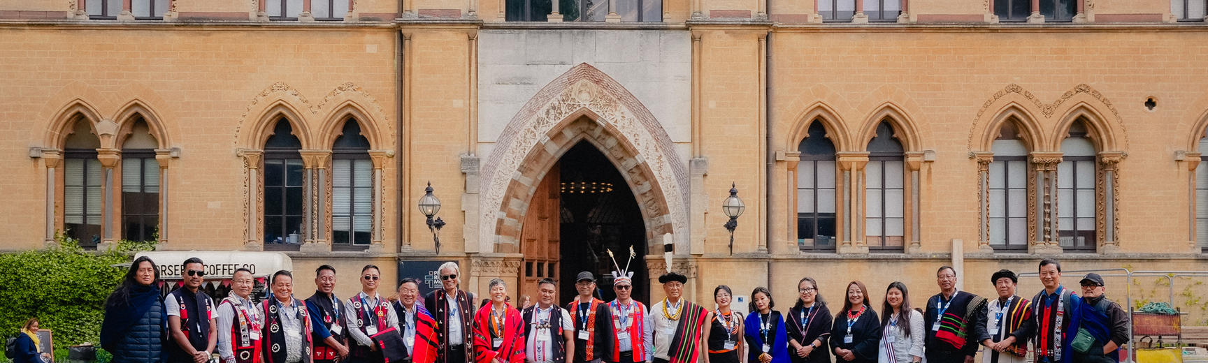 Naga delegation standing on lawn outside museum