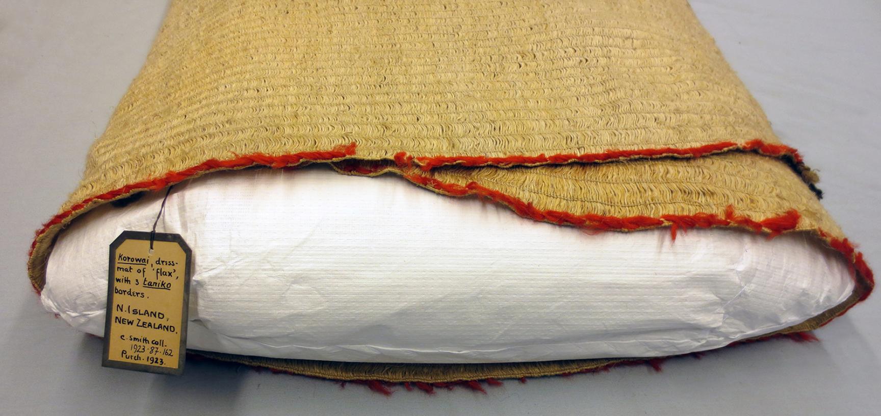 Detail of cloak (1923.87.162) wrapped around internal cushion support