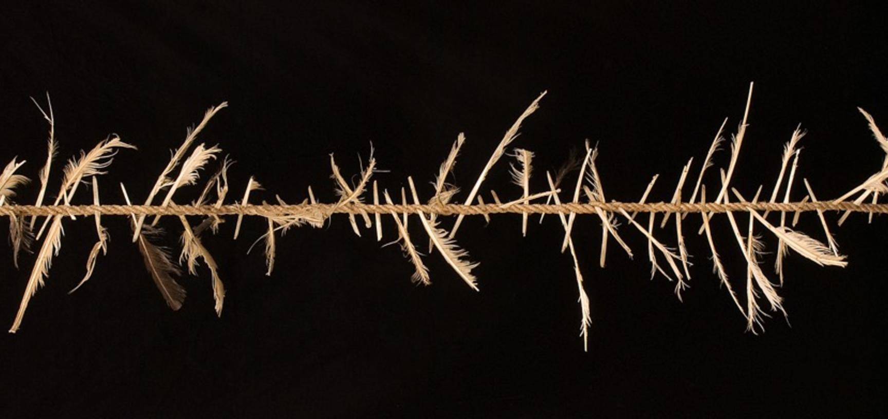 ‘Witch's ladder’ made of rope tied with feathers, England.
