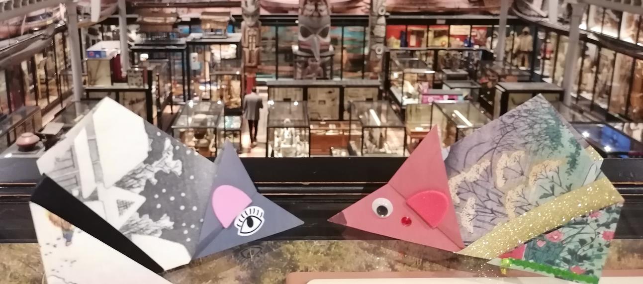 Paper mice against backdrop of museum