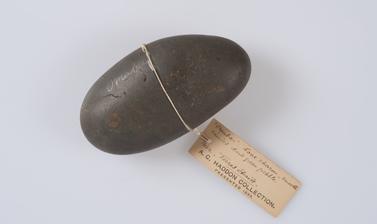 Omabar (smooth rounded pebble used as a love charm), Torres Straits, Australia.
