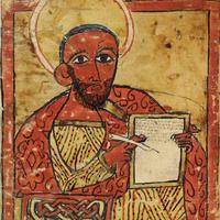 Detail from illustrated manuscript showing the Evangelist Luke holding a page and a pen