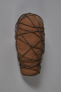 Red laterite clay wrapped in wire